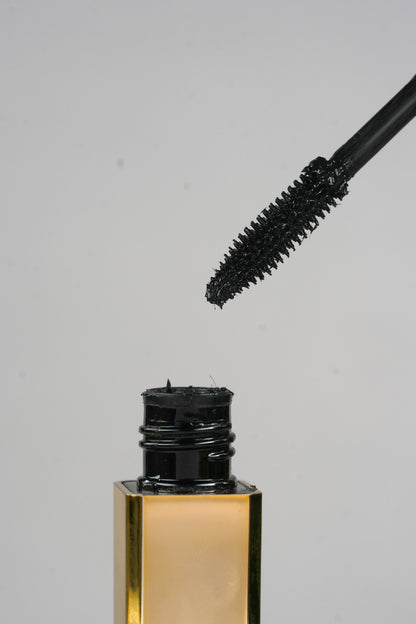 Black mascara before-and-after comparison showing lash volume